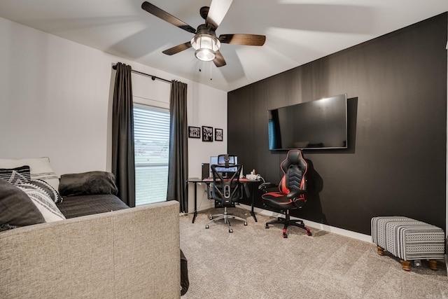 carpeted bedroom featuring baseboards and a ceiling fan