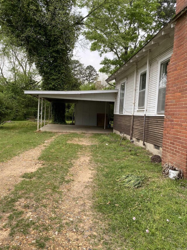 141 N Church St, Mineral Sprs, AR 71851 - view of yard featuring a carport and dirt driveway