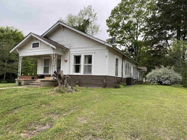 141 N Church St, Mineral Sprs, AR 71851 - bungalow-style house with a front lawn, central AC, and a porch