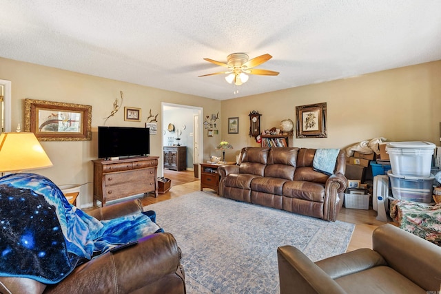 3613 Northlake Rd, Alexander, AR 72002 - living area with wood finished floors, ceiling fan, and a textured ceiling