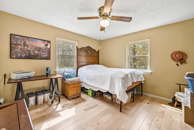 3613 Northlake Rd, Alexander, AR 72002 - bedroom with baseboards, a ceiling fan, wood finished floors, and a textured ceiling