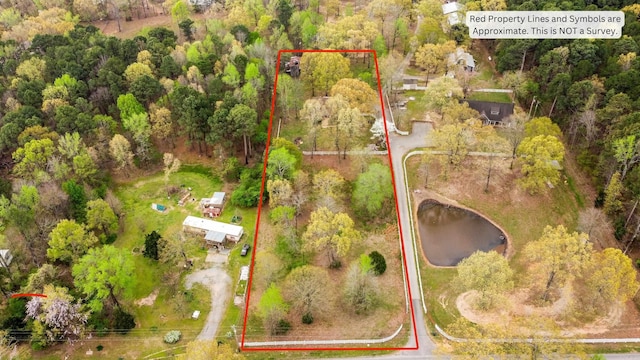 3613 Northlake Rd, Alexander, AR 72002 - birds eye view of property featuring a wooded view