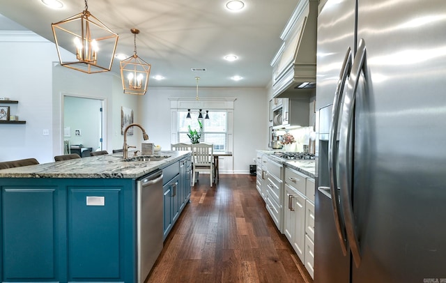 411 Sienna Lake Dr, Little Rock, AR 72210 - kitchen with blue cabinetry, crown molding, a sink, and stainless steel appliances