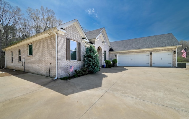 411 Sienna Lake Dr, Little Rock, AR 72210 - view of front of home featuring brick siding, driveway, and a garage