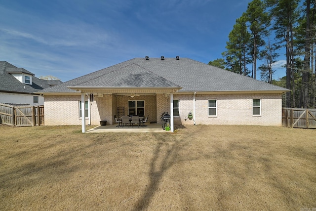 411 Sienna Lake Dr, Little Rock, AR 72210 - back of house with a patio, a fenced backyard, brick siding, a shingled roof, and a lawn