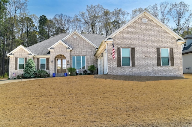 411 Sienna Lake Dr, Little Rock, AR 72210 - ranch-style home featuring a front lawn, brick siding, a shingled roof, and an attached garage