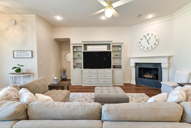 411 Sienna Lake Dr, Little Rock, AR 72210 - living room with visible vents, a high end fireplace, crown molding, ceiling fan, and dark wood-style floors
