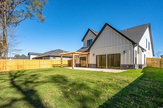 back of property with a patio, a fenced backyard, a pergola, board and batten siding, and a yard