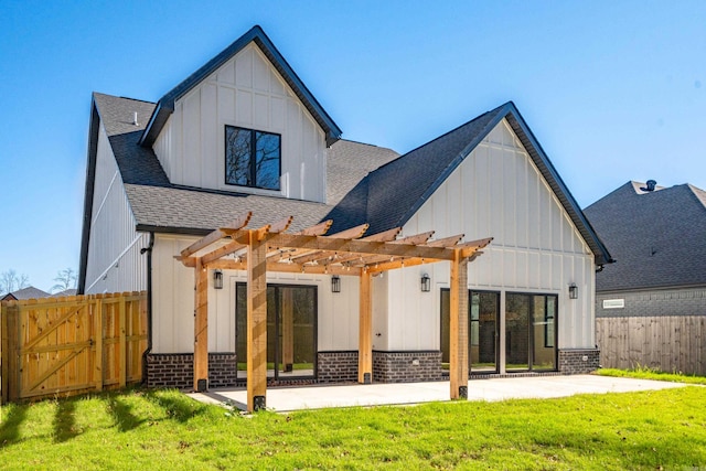 rear view of house featuring a shingled roof, fence, board and batten siding, and a pergola