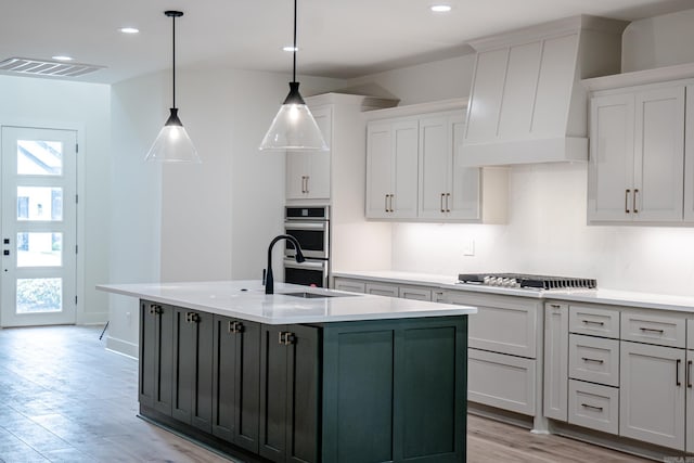 kitchen with a healthy amount of sunlight, visible vents, light countertops, and stainless steel appliances