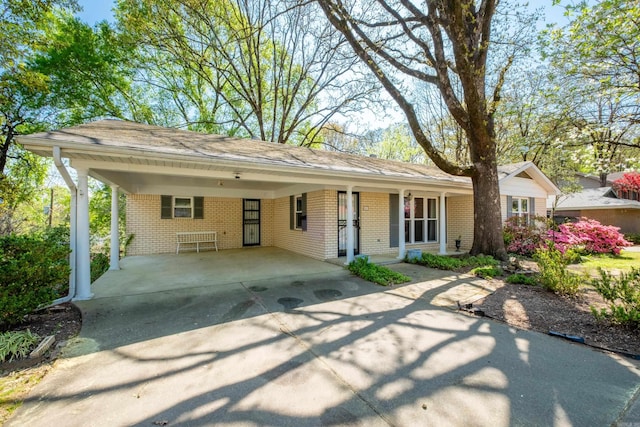 621 Mcadoo St, Little Rock, AR 72205 - ranch-style house with an attached carport, brick siding, and driveway