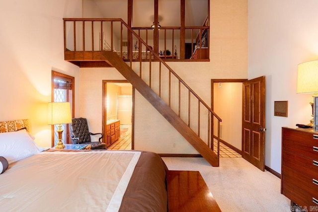 1110 Huntington Pl, Heber Springs, AR 72543 - bedroom with baseboards, a towering ceiling, and ensuite bathroom