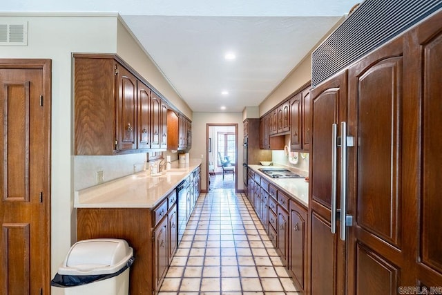 1110 Huntington Pl, Heber Springs, AR 72543 - kitchen with light countertops, paneled refrigerator, a sink, visible vents, and stainless steel stovetop