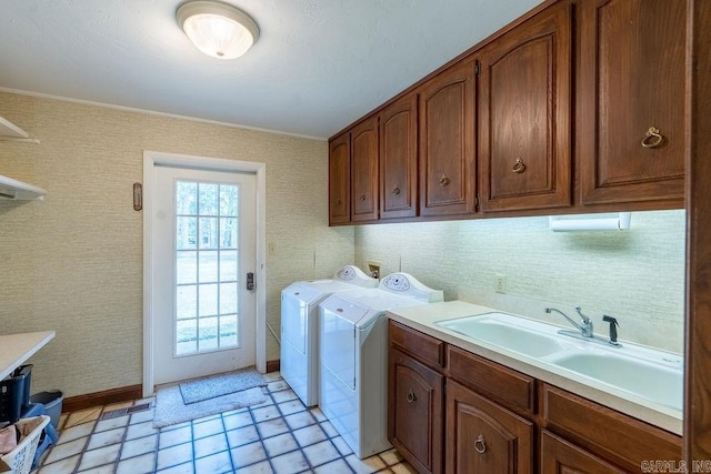 1110 Huntington Pl, Heber Springs, AR 72543 - clothes washing area with wallpapered walls, a sink, cabinet space, and separate washer and dryer