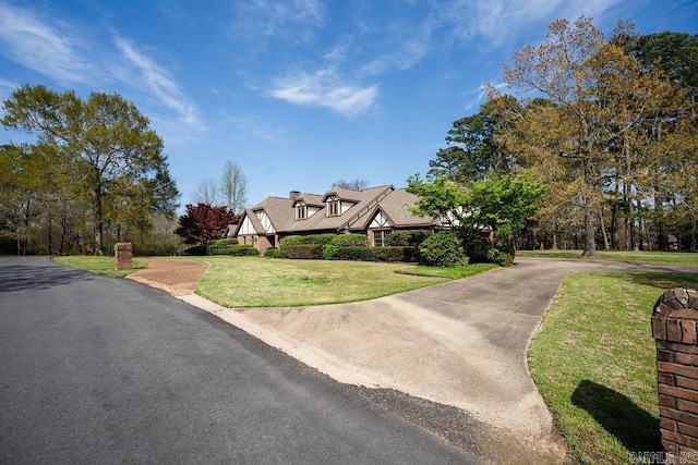 1110 Huntington Pl, Heber Springs, AR 72543 - exterior space with concrete driveway and a front lawn