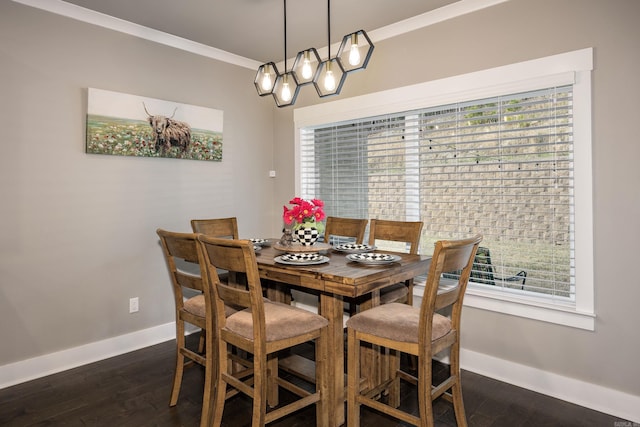 dining space featuring baseboards, dark wood-style flooring, and ornamental molding