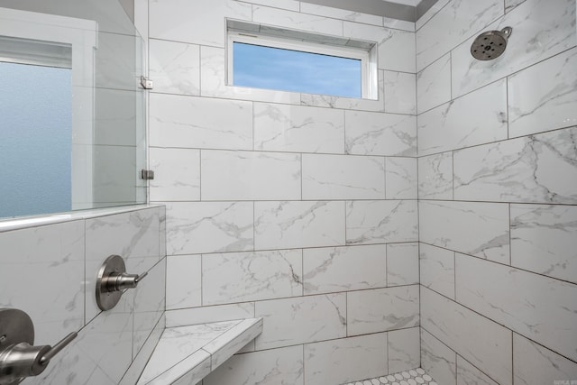 full bathroom featuring a tile shower