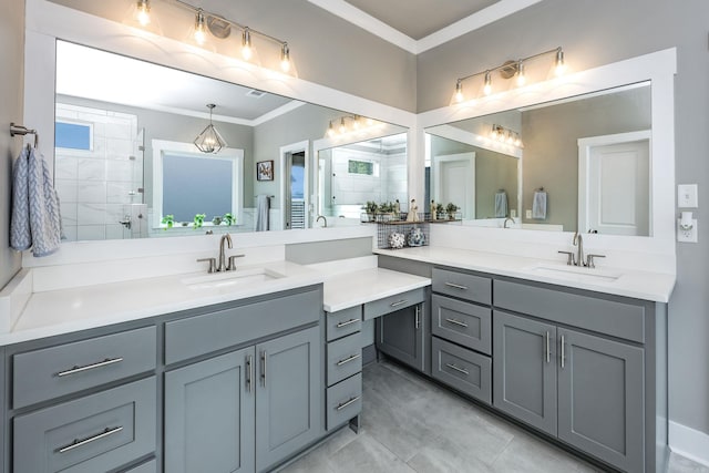 bathroom featuring vanity, ornamental molding, and tiled shower