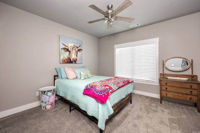 bedroom with carpet, baseboards, ceiling fan, and visible vents