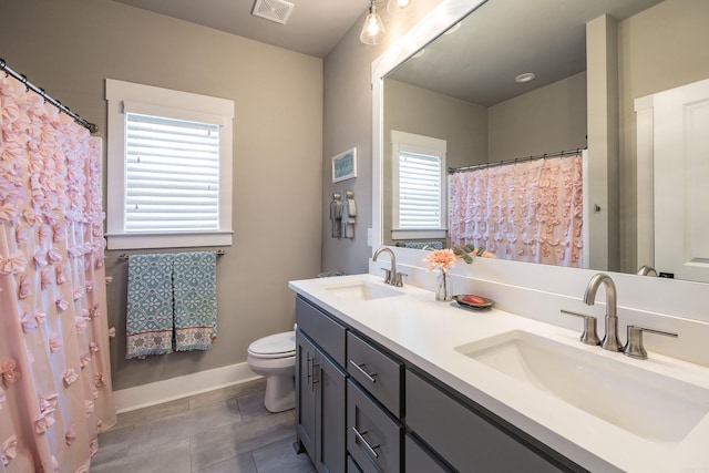 full bathroom featuring visible vents, a sink, toilet, and tile patterned floors