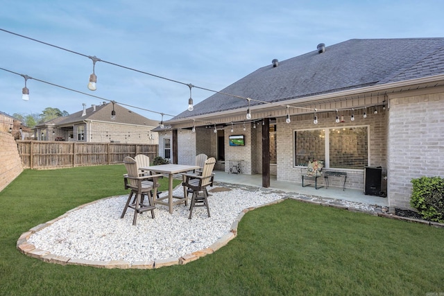view of yard with fence and a patio