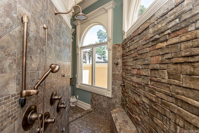 bathroom with tiled shower