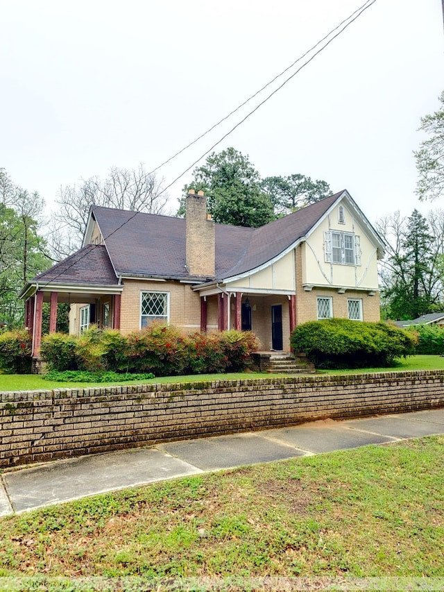 view of front facade featuring a chimney