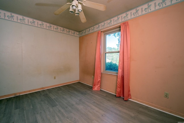 spare room featuring baseboards, a textured ceiling, ceiling fan, and wood finished floors
