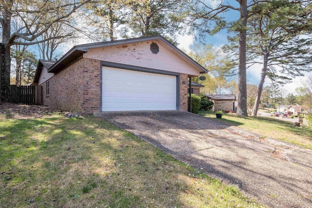 garage featuring aphalt driveway