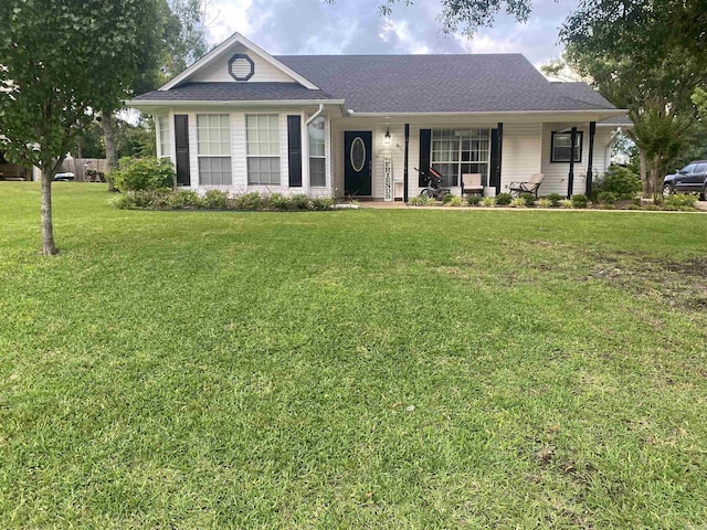 6 Timber Ridge Dr, Atlanta, TX 75551 - single story home featuring covered porch, roof with shingles, and a front lawn