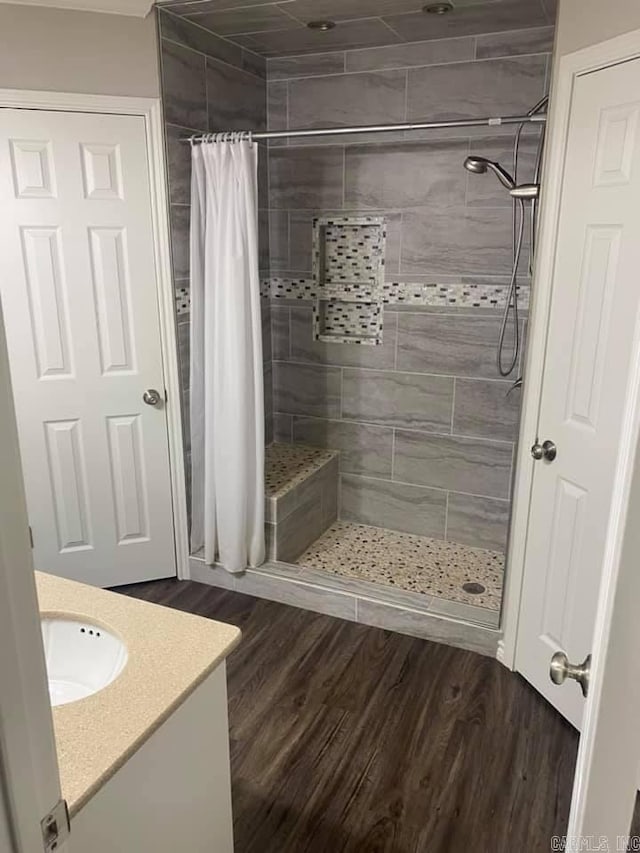 6 Timber Ridge Dr, Atlanta, TX 75551 - full bath with vanity, wood finished floors, and a shower stall