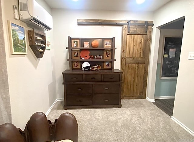 6 Timber Ridge Dr, Atlanta, TX 75551 - interior space featuring carpet flooring, a wall unit AC, baseboards, and a barn door