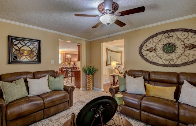 7200 Nell Dr, Pine Bluff, AR 71603 - living area with a ceiling fan, a textured ceiling, light tile patterned floors, baseboards, and ornamental molding
