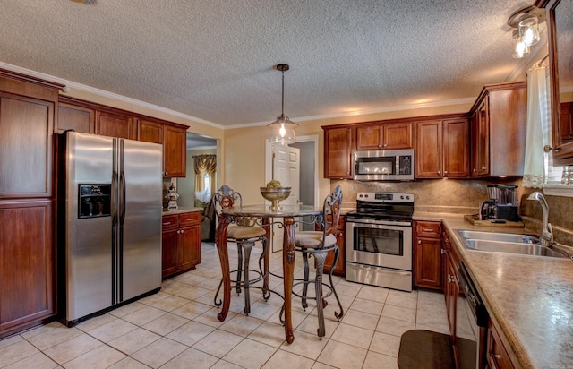 7200 Nell Dr, Pine Bluff, AR 71603 - kitchen featuring a sink, light tile patterned floors, stainless steel appliances, decorative backsplash, and ornamental molding