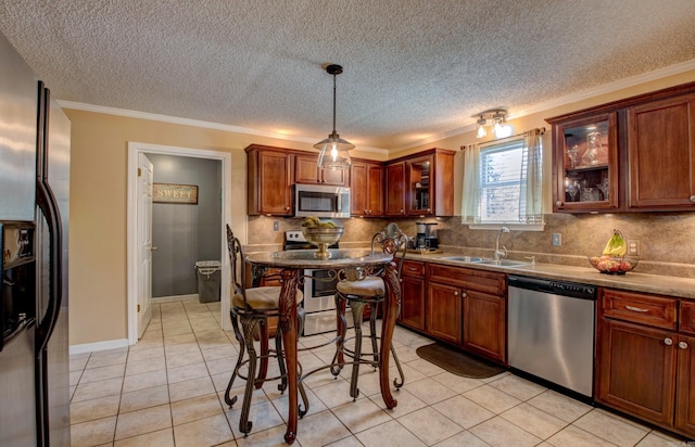 7200 Nell Dr, Pine Bluff, AR 71603 - kitchen with a sink, tasteful backsplash, glass insert cabinets, stainless steel appliances, and ornamental molding