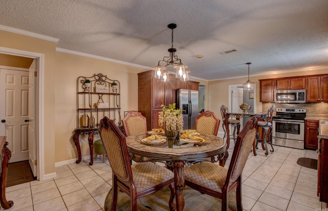 7200 Nell Dr, Pine Bluff, AR 71603 - dining space featuring light tile patterned flooring, crown molding, a textured ceiling, and visible vents