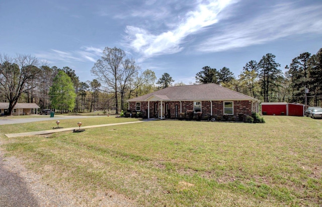 7200 Nell Dr, Pine Bluff, AR 71603 - view of front of property featuring a front lawn and brick siding
