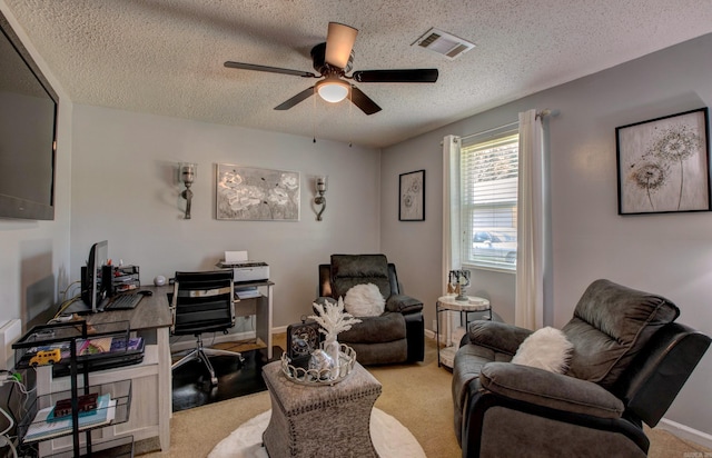 7200 Nell Dr, Pine Bluff, AR 71603 - carpeted living room featuring a textured ceiling, visible vents, baseboards, and a ceiling fan