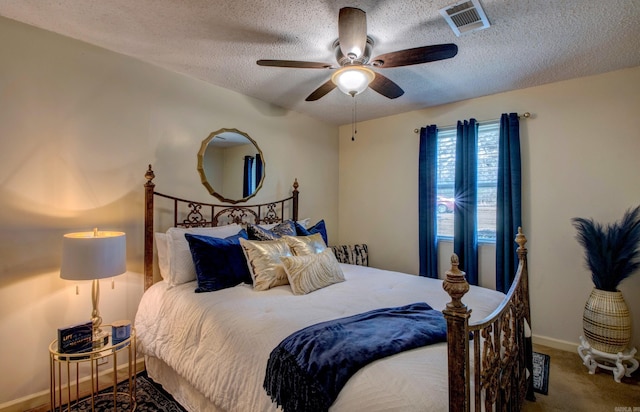 7200 Nell Dr, Pine Bluff, AR 71603 - carpeted bedroom with a ceiling fan, a textured ceiling, baseboards, and visible vents