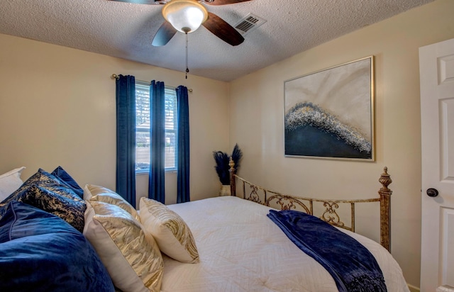 7200 Nell Dr, Pine Bluff, AR 71603 - bedroom with a textured ceiling, visible vents, and a ceiling fan