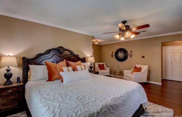 7200 Nell Dr, Pine Bluff, AR 71603 - bedroom with visible vents, wood finished floors, ornamental molding, and a textured ceiling