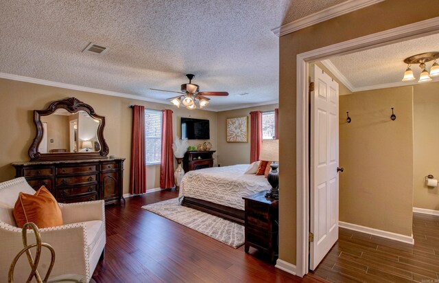 7200 Nell Dr, Pine Bluff, AR 71603 - bedroom with multiple windows, visible vents, crown molding, and dark wood-style flooring