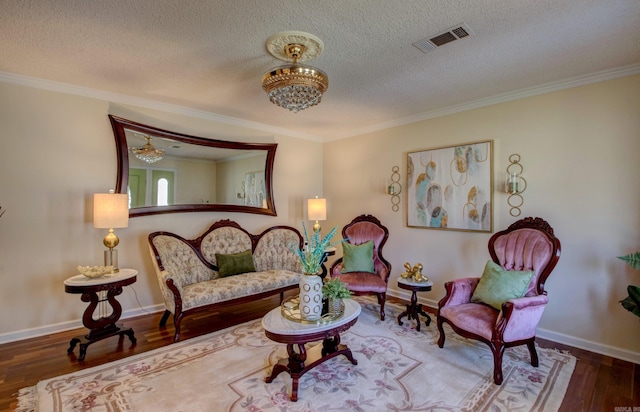 7200 Nell Dr, Pine Bluff, AR 71603 - living area with a textured ceiling, visible vents, a chandelier, and wood finished floors