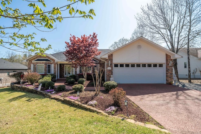 single story home with brick siding, driveway, an attached garage, and a front lawn