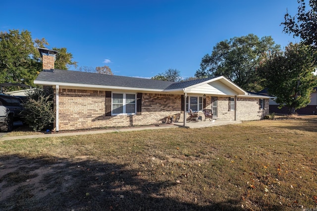 168 Leta Ln, Hot Springs, AR 71913 - ranch-style house featuring a chimney, a front yard, a patio, and brick siding