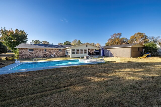 168 Leta Ln, Hot Springs, AR 71913 - back of property featuring an outdoor pool, an outbuilding, a yard, and a patio