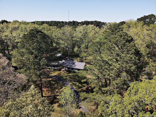 drone / aerial view featuring a forest view