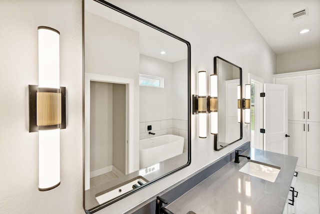 6172 Majestic Waters Dr, Alexander, AR 72002 - bathroom featuring double vanity and recessed lighting