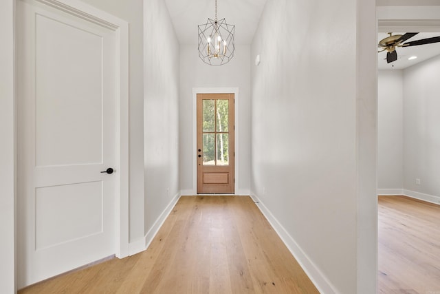 6172 Majestic Waters Dr, Alexander, AR 72002 - doorway to outside featuring light wood-style floors, a chandelier, baseboards, and ceiling fan