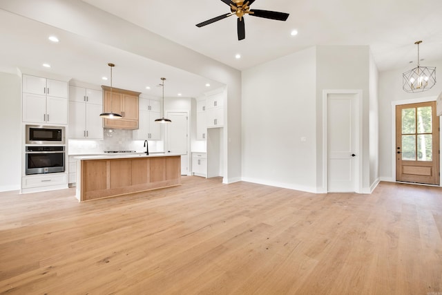 6172 Majestic Waters Dr, Alexander, AR 72002 - kitchen with oven, built in microwave, open floor plan, and recessed lighting